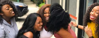 image of women laughing and smiling